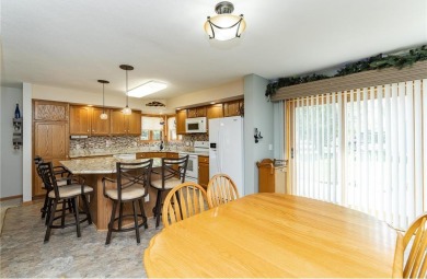 Ideally situated on a corner lot, this well-kept rambler offers on Dodge Country Club in Minnesota - for sale on GolfHomes.com, golf home, golf lot