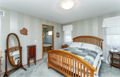 Ideally situated on a corner lot, this well-kept rambler offers on Dodge Country Club in Minnesota - for sale on GolfHomes.com, golf home, golf lot