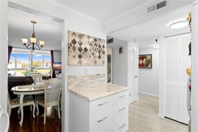 Bright and open 1/1 condo in Phase 3 of Sunrise Lakes community on Sunrise Lakes Phase III in Florida - for sale on GolfHomes.com, golf home, golf lot
