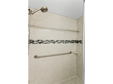Bright and open 1/1 condo in Phase 3 of Sunrise Lakes community on Sunrise Lakes Phase III in Florida - for sale on GolfHomes.com, golf home, golf lot
