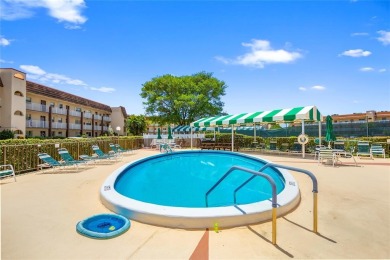 Bright and open 1/1 condo in Phase 3 of Sunrise Lakes community on Sunrise Lakes Phase III in Florida - for sale on GolfHomes.com, golf home, golf lot
