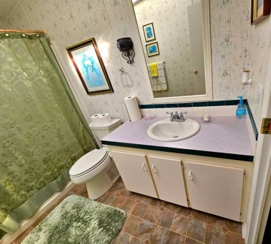 This home is on leased land. Buyers do not own the land. This on Big Cypress Golf and Country Club in Florida - for sale on GolfHomes.com, golf home, golf lot