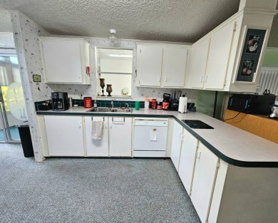 This home is on leased land. Buyers do not own the land. This on Big Cypress Golf and Country Club in Florida - for sale on GolfHomes.com, golf home, golf lot
