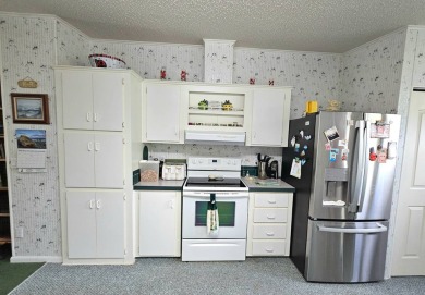 This home is on leased land. Buyers do not own the land. This on Big Cypress Golf and Country Club in Florida - for sale on GolfHomes.com, golf home, golf lot