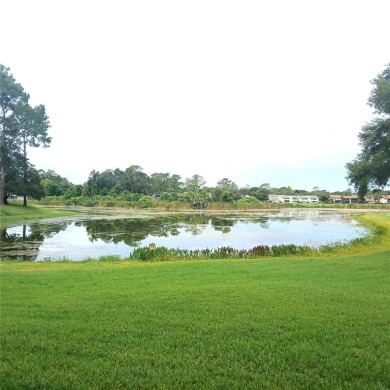 Two bedroom, one and a half bath second floor condominium on Country Club At Silver Springs Shores in Florida - for sale on GolfHomes.com, golf home, golf lot