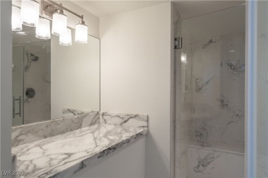 Welcome to a thoughtfully refined private corner unit, situated on Las Vegas Country Club in Nevada - for sale on GolfHomes.com, golf home, golf lot