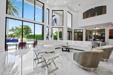 Experience breathtaking long lake views from this grand estate on St. Andrews Country Club of Boca Raton in Florida - for sale on GolfHomes.com, golf home, golf lot
