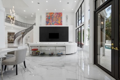 Experience breathtaking long lake views from this grand estate on St. Andrews Country Club of Boca Raton in Florida - for sale on GolfHomes.com, golf home, golf lot
