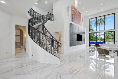 Experience breathtaking long lake views from this grand estate on St. Andrews Country Club of Boca Raton in Florida - for sale on GolfHomes.com, golf home, golf lot