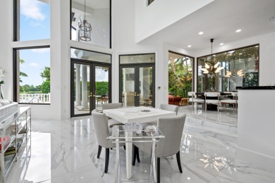 Experience breathtaking long lake views from this grand estate on St. Andrews Country Club of Boca Raton in Florida - for sale on GolfHomes.com, golf home, golf lot