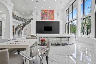 Experience breathtaking long lake views from this grand estate on St. Andrews Country Club of Boca Raton in Florida - for sale on GolfHomes.com, golf home, golf lot