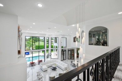 Experience breathtaking long lake views from this grand estate on St. Andrews Country Club of Boca Raton in Florida - for sale on GolfHomes.com, golf home, golf lot