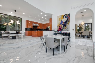 Experience breathtaking long lake views from this grand estate on St. Andrews Country Club of Boca Raton in Florida - for sale on GolfHomes.com, golf home, golf lot