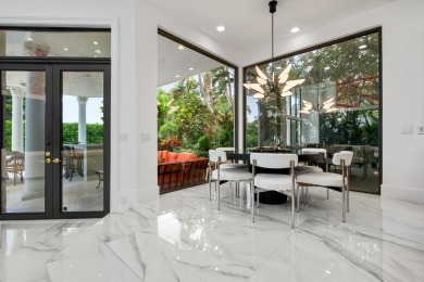 Experience breathtaking long lake views from this grand estate on St. Andrews Country Club of Boca Raton in Florida - for sale on GolfHomes.com, golf home, golf lot