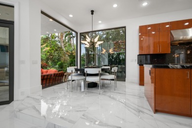 Experience breathtaking long lake views from this grand estate on St. Andrews Country Club of Boca Raton in Florida - for sale on GolfHomes.com, golf home, golf lot