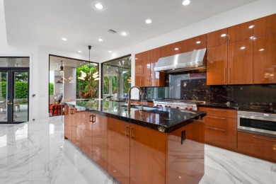 Experience breathtaking long lake views from this grand estate on St. Andrews Country Club of Boca Raton in Florida - for sale on GolfHomes.com, golf home, golf lot