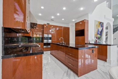 Experience breathtaking long lake views from this grand estate on St. Andrews Country Club of Boca Raton in Florida - for sale on GolfHomes.com, golf home, golf lot
