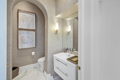 Experience breathtaking long lake views from this grand estate on St. Andrews Country Club of Boca Raton in Florida - for sale on GolfHomes.com, golf home, golf lot