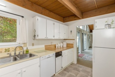 Discover a captivating retreat in Holly Forest with this classic on Sapphire National Golf Club in North Carolina - for sale on GolfHomes.com, golf home, golf lot