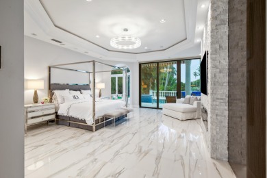 Experience breathtaking long lake views from this grand estate on St. Andrews Country Club of Boca Raton in Florida - for sale on GolfHomes.com, golf home, golf lot