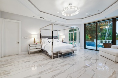 Experience breathtaking long lake views from this grand estate on St. Andrews Country Club of Boca Raton in Florida - for sale on GolfHomes.com, golf home, golf lot