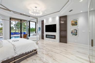 Experience breathtaking long lake views from this grand estate on St. Andrews Country Club of Boca Raton in Florida - for sale on GolfHomes.com, golf home, golf lot