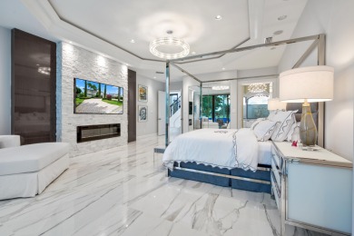 Experience breathtaking long lake views from this grand estate on St. Andrews Country Club of Boca Raton in Florida - for sale on GolfHomes.com, golf home, golf lot