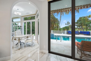 Experience breathtaking long lake views from this grand estate on St. Andrews Country Club of Boca Raton in Florida - for sale on GolfHomes.com, golf home, golf lot