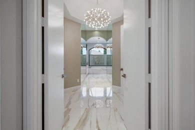 Experience breathtaking long lake views from this grand estate on St. Andrews Country Club of Boca Raton in Florida - for sale on GolfHomes.com, golf home, golf lot