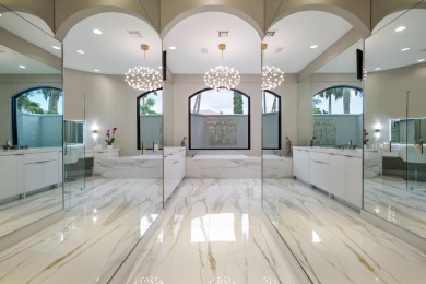 Experience breathtaking long lake views from this grand estate on St. Andrews Country Club of Boca Raton in Florida - for sale on GolfHomes.com, golf home, golf lot