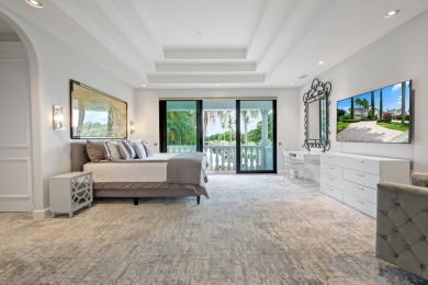 Experience breathtaking long lake views from this grand estate on St. Andrews Country Club of Boca Raton in Florida - for sale on GolfHomes.com, golf home, golf lot