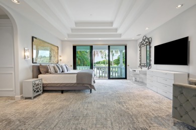 Experience breathtaking long lake views from this grand estate on St. Andrews Country Club of Boca Raton in Florida - for sale on GolfHomes.com, golf home, golf lot