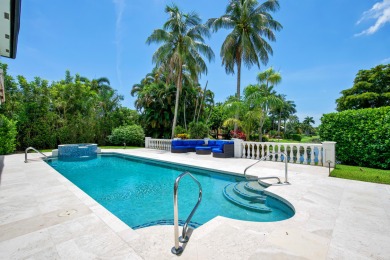 Experience breathtaking long lake views from this grand estate on St. Andrews Country Club of Boca Raton in Florida - for sale on GolfHomes.com, golf home, golf lot