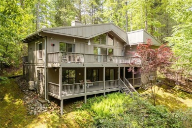 Discover a captivating retreat in Holly Forest with this classic on Sapphire National Golf Club in North Carolina - for sale on GolfHomes.com, golf home, golf lot
