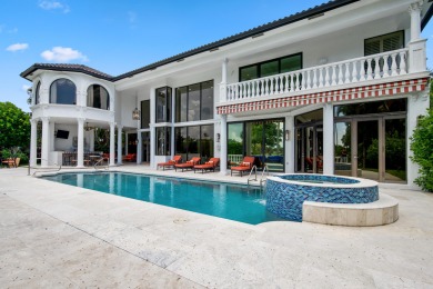 Experience breathtaking long lake views from this grand estate on St. Andrews Country Club of Boca Raton in Florida - for sale on GolfHomes.com, golf home, golf lot