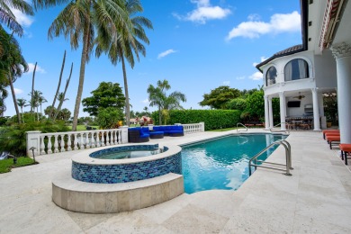 Experience breathtaking long lake views from this grand estate on St. Andrews Country Club of Boca Raton in Florida - for sale on GolfHomes.com, golf home, golf lot