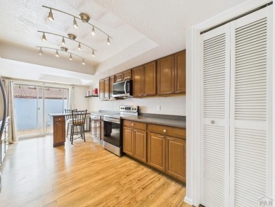 Spacious 2,028 sq ft Spanish Mediterranean-style townhome on Desert Hawk At Pueblo West in Colorado - for sale on GolfHomes.com, golf home, golf lot