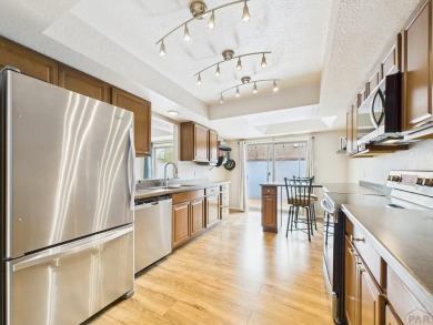 Spacious 2,028 sq ft Spanish Mediterranean-style townhome on Desert Hawk At Pueblo West in Colorado - for sale on GolfHomes.com, golf home, golf lot