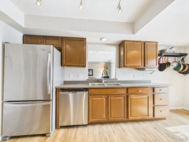 Spacious 2,028 sq ft Spanish Mediterranean-style townhome on Desert Hawk At Pueblo West in Colorado - for sale on GolfHomes.com, golf home, golf lot