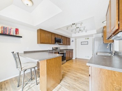 Spacious 2,028 sq ft Spanish Mediterranean-style townhome on Desert Hawk At Pueblo West in Colorado - for sale on GolfHomes.com, golf home, golf lot