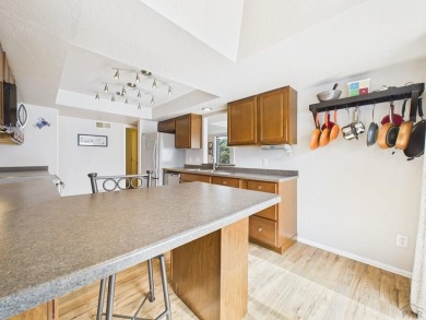 Spacious 2,028 sq ft Spanish Mediterranean-style townhome on Desert Hawk At Pueblo West in Colorado - for sale on GolfHomes.com, golf home, golf lot