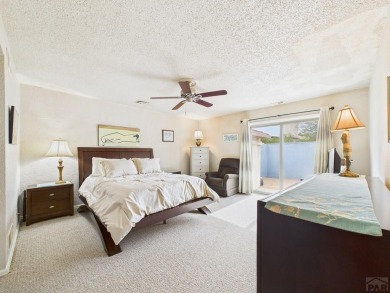 Spacious 2,028 sq ft Spanish Mediterranean-style townhome on Desert Hawk At Pueblo West in Colorado - for sale on GolfHomes.com, golf home, golf lot