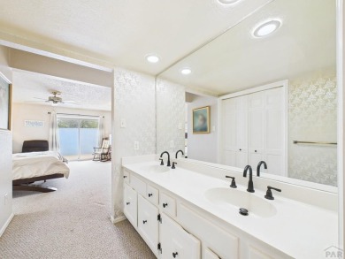Spacious 2,028 sq ft Spanish Mediterranean-style townhome on Desert Hawk At Pueblo West in Colorado - for sale on GolfHomes.com, golf home, golf lot