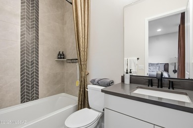 This exceptional, former Fairfield model home blends elevated on Omni Tucson National Golf Resort and Spa - Catalina in Arizona - for sale on GolfHomes.com, golf home, golf lot