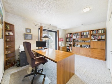 Spacious 2,028 sq ft Spanish Mediterranean-style townhome on Desert Hawk At Pueblo West in Colorado - for sale on GolfHomes.com, golf home, golf lot