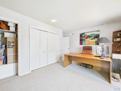 Spacious 2,028 sq ft Spanish Mediterranean-style townhome on Desert Hawk At Pueblo West in Colorado - for sale on GolfHomes.com, golf home, golf lot