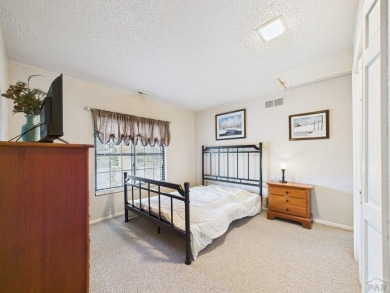 Spacious 2,028 sq ft Spanish Mediterranean-style townhome on Desert Hawk At Pueblo West in Colorado - for sale on GolfHomes.com, golf home, golf lot