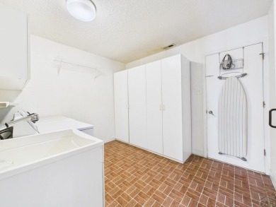 Spacious 2,028 sq ft Spanish Mediterranean-style townhome on Desert Hawk At Pueblo West in Colorado - for sale on GolfHomes.com, golf home, golf lot