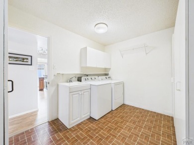 Spacious 2,028 sq ft Spanish Mediterranean-style townhome on Desert Hawk At Pueblo West in Colorado - for sale on GolfHomes.com, golf home, golf lot