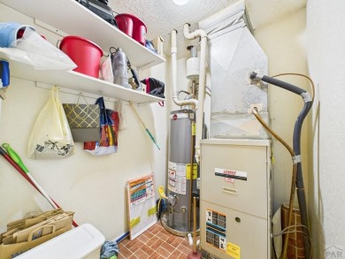 Spacious 2,028 sq ft Spanish Mediterranean-style townhome on Desert Hawk At Pueblo West in Colorado - for sale on GolfHomes.com, golf home, golf lot